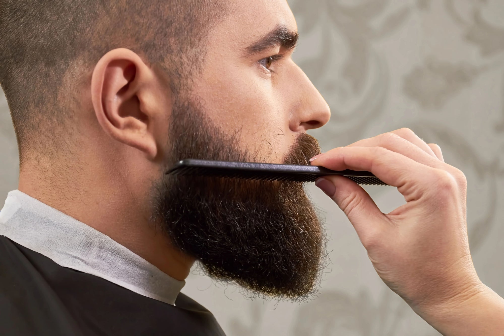 man with beard comb in his beard 